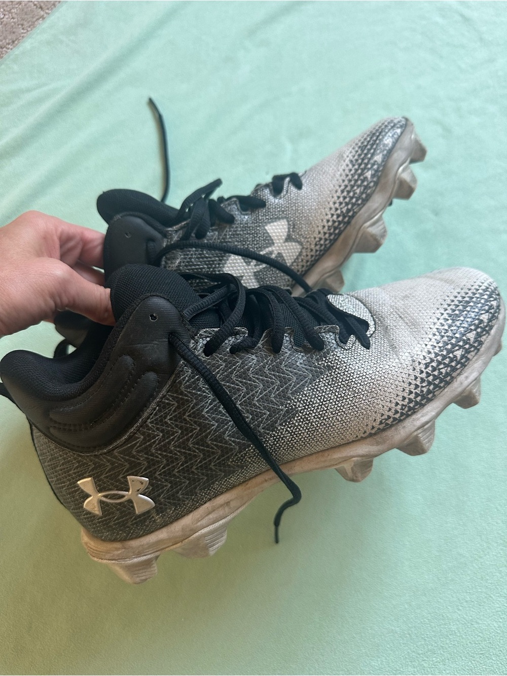 Youth Under Armour Gray and Black Cleats